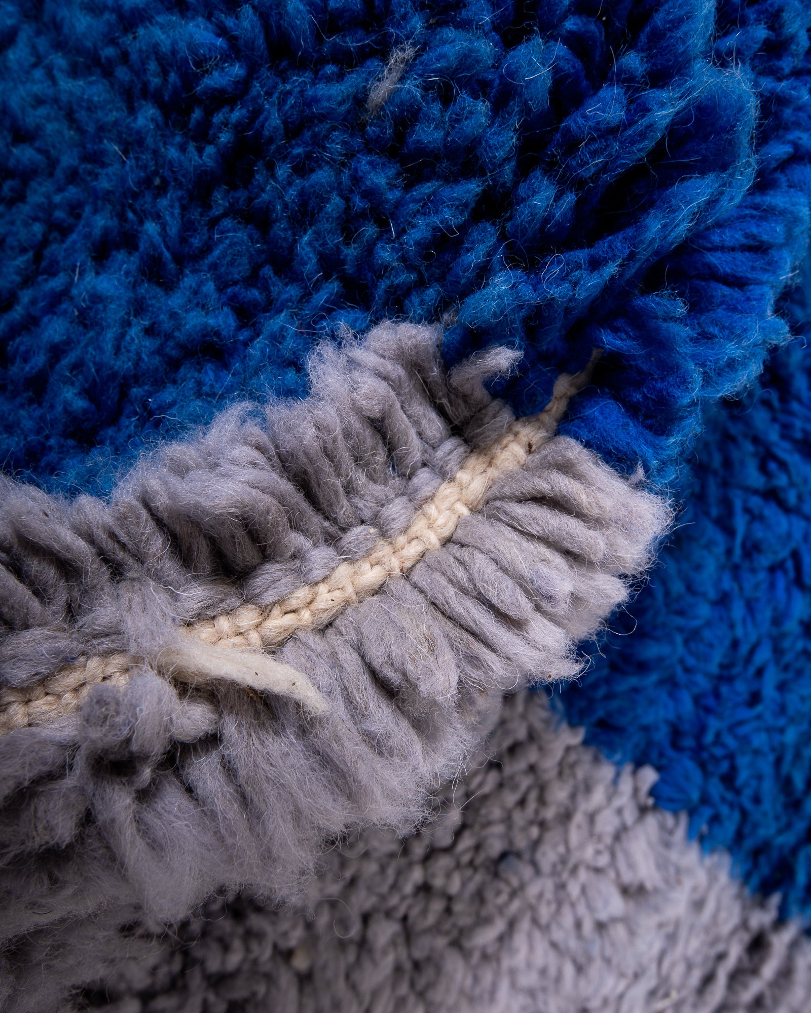 Modern, designer, handcrafted Berber rug from Morocco. Beniourain carpet with beautiful colours and patterns and fluffy wool texture.
